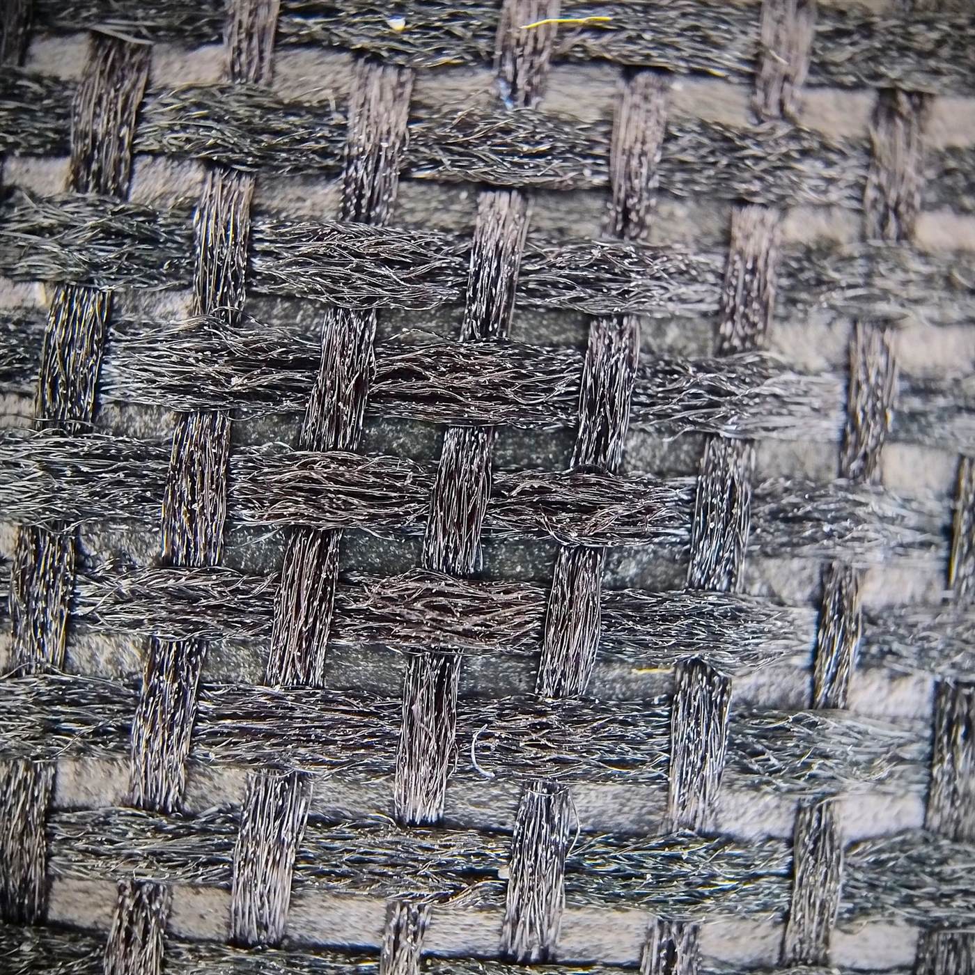 Macro detail of fabric weave showing thread-level texture accuracy